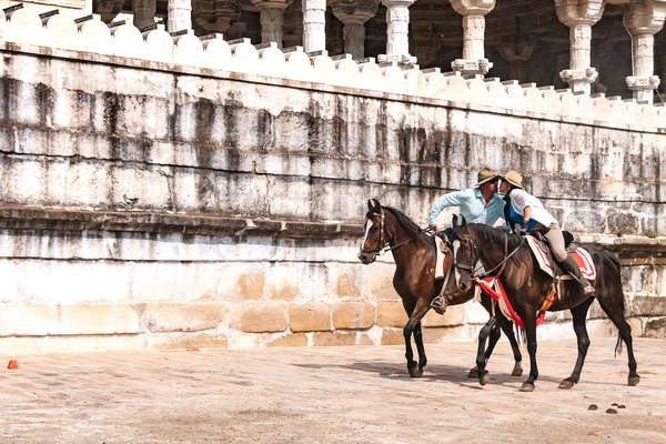 A couple on horseback in Rajasthan on a trail riding holiday